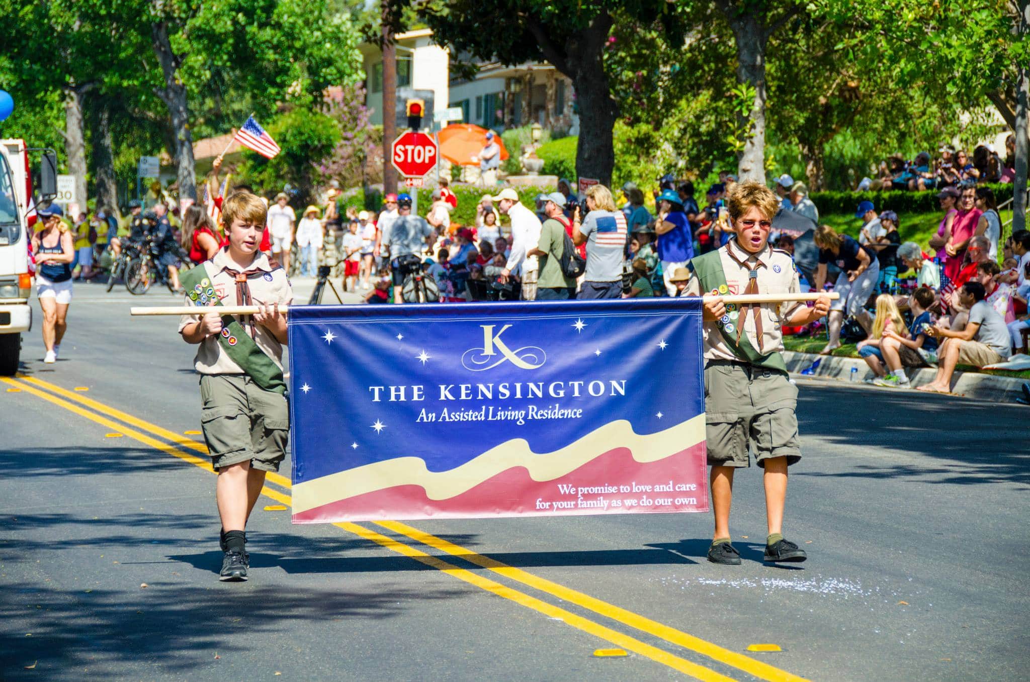 boy scouts carry kensington banner at the fourth of july parade