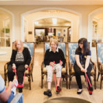 adults and elderly engaging in chair exercises