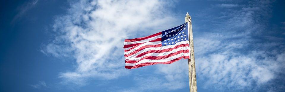 American Flag against blue sky on Flag Day.