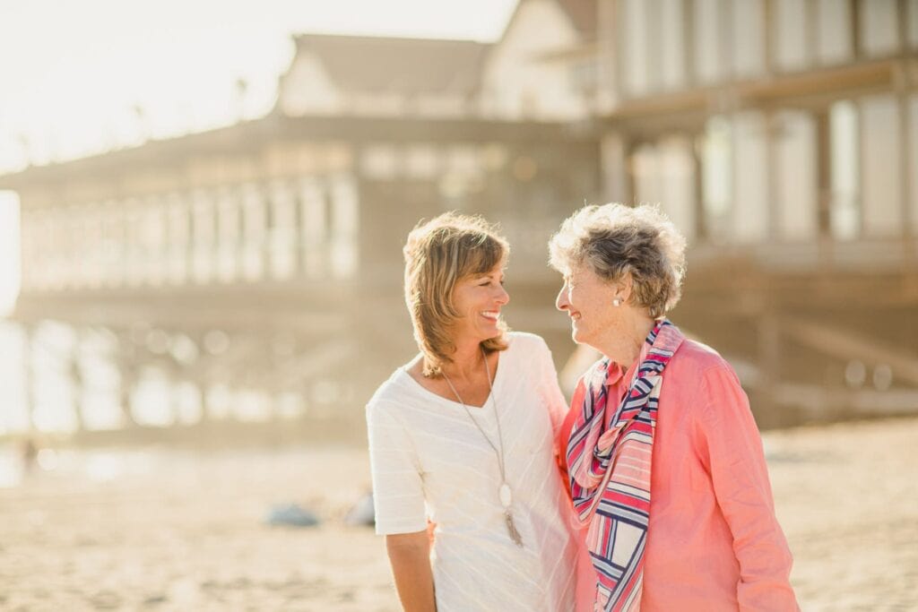 woman and elderly lady at the beach