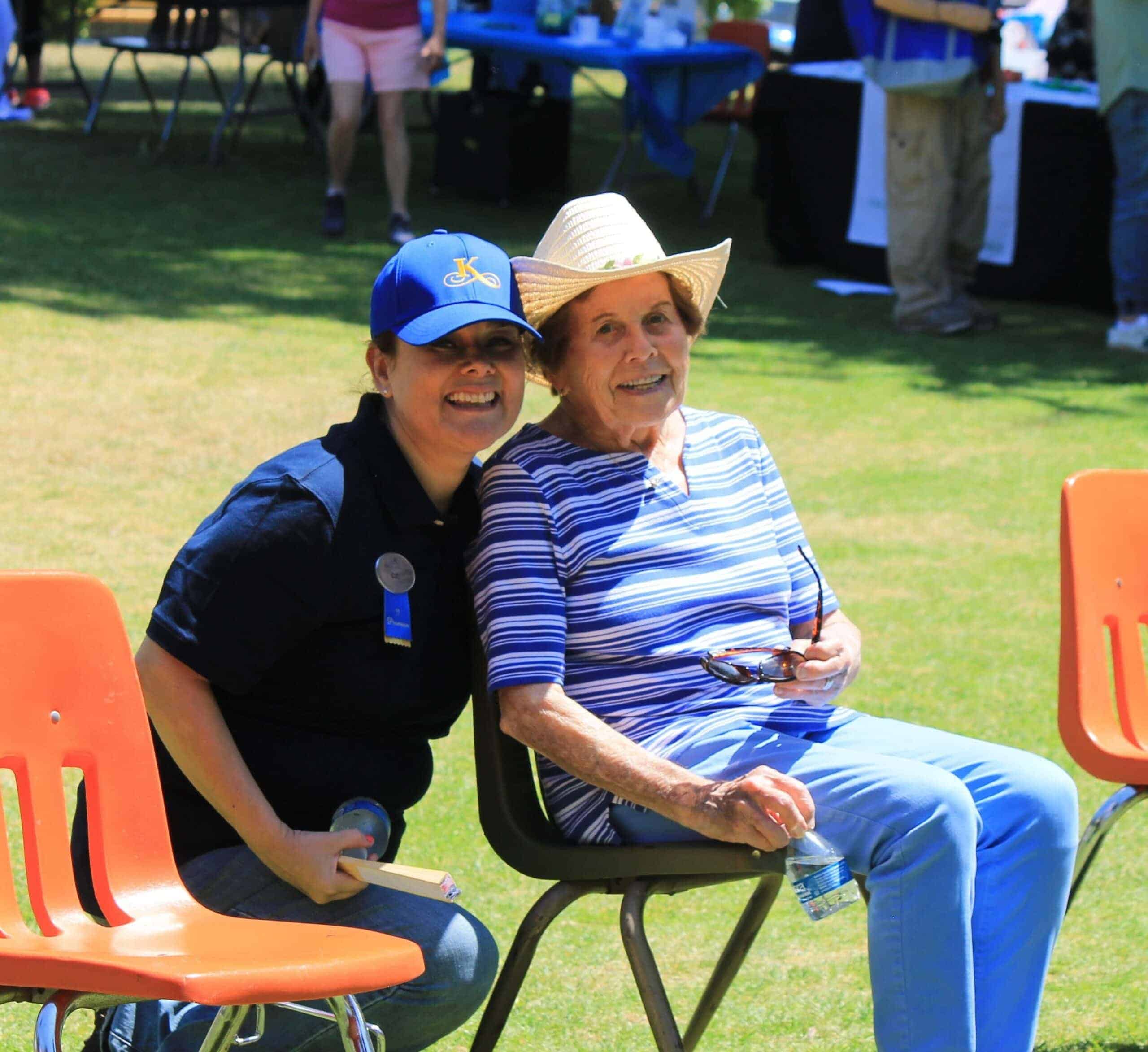 team member and resident enjoying an event