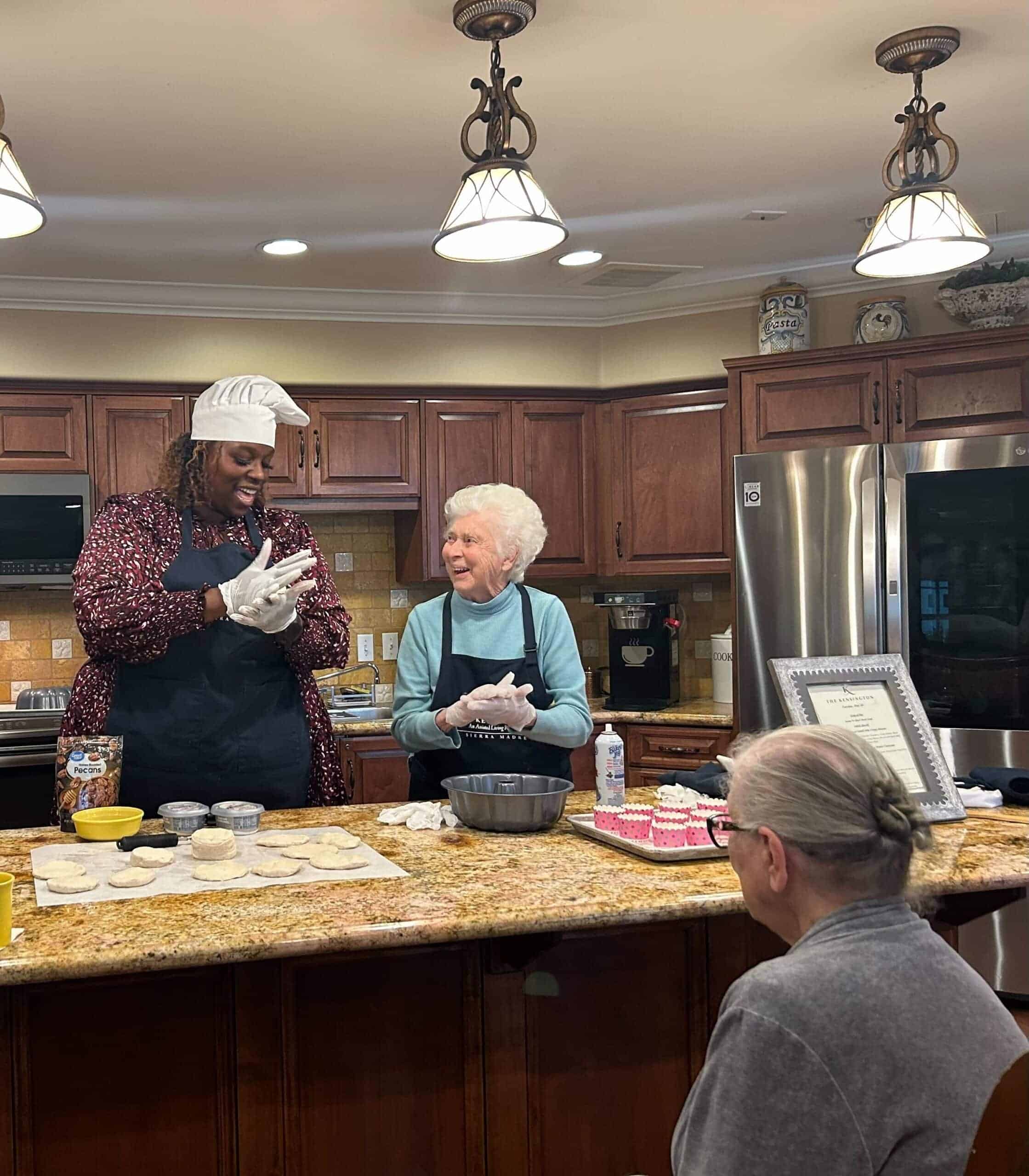 resident and team member baking together