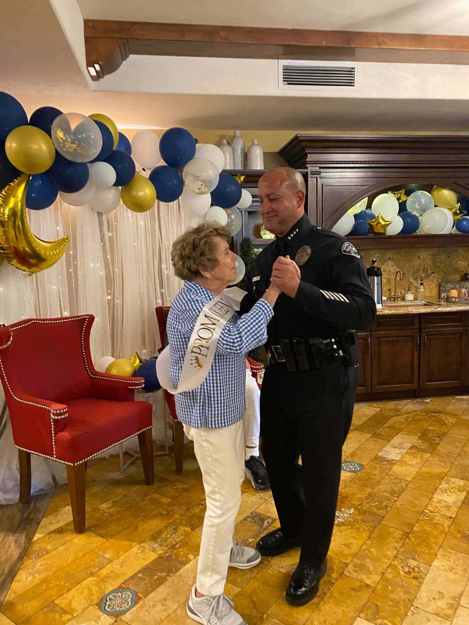 resident dancing with cop at prom event