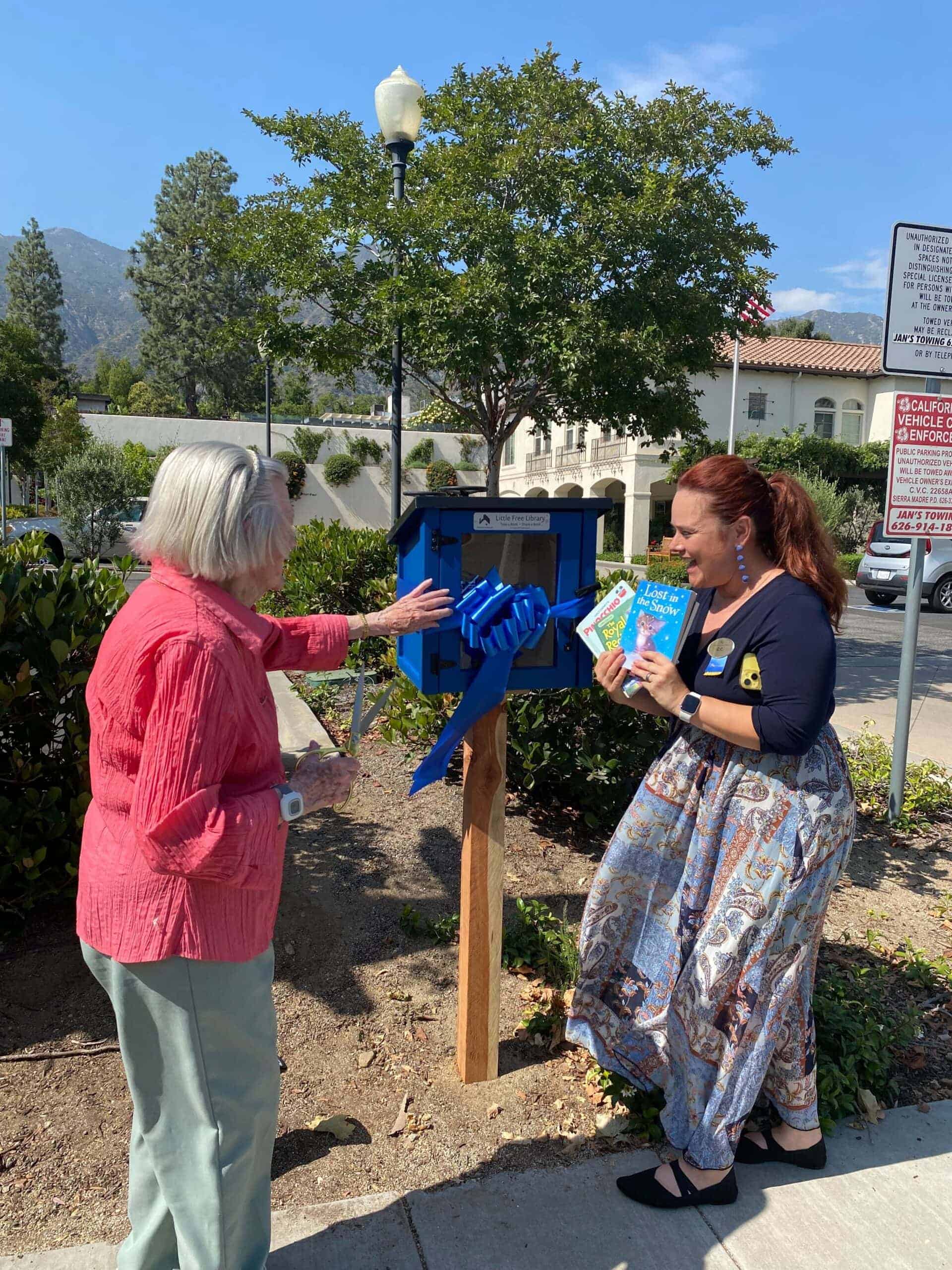 resident and team member donating books