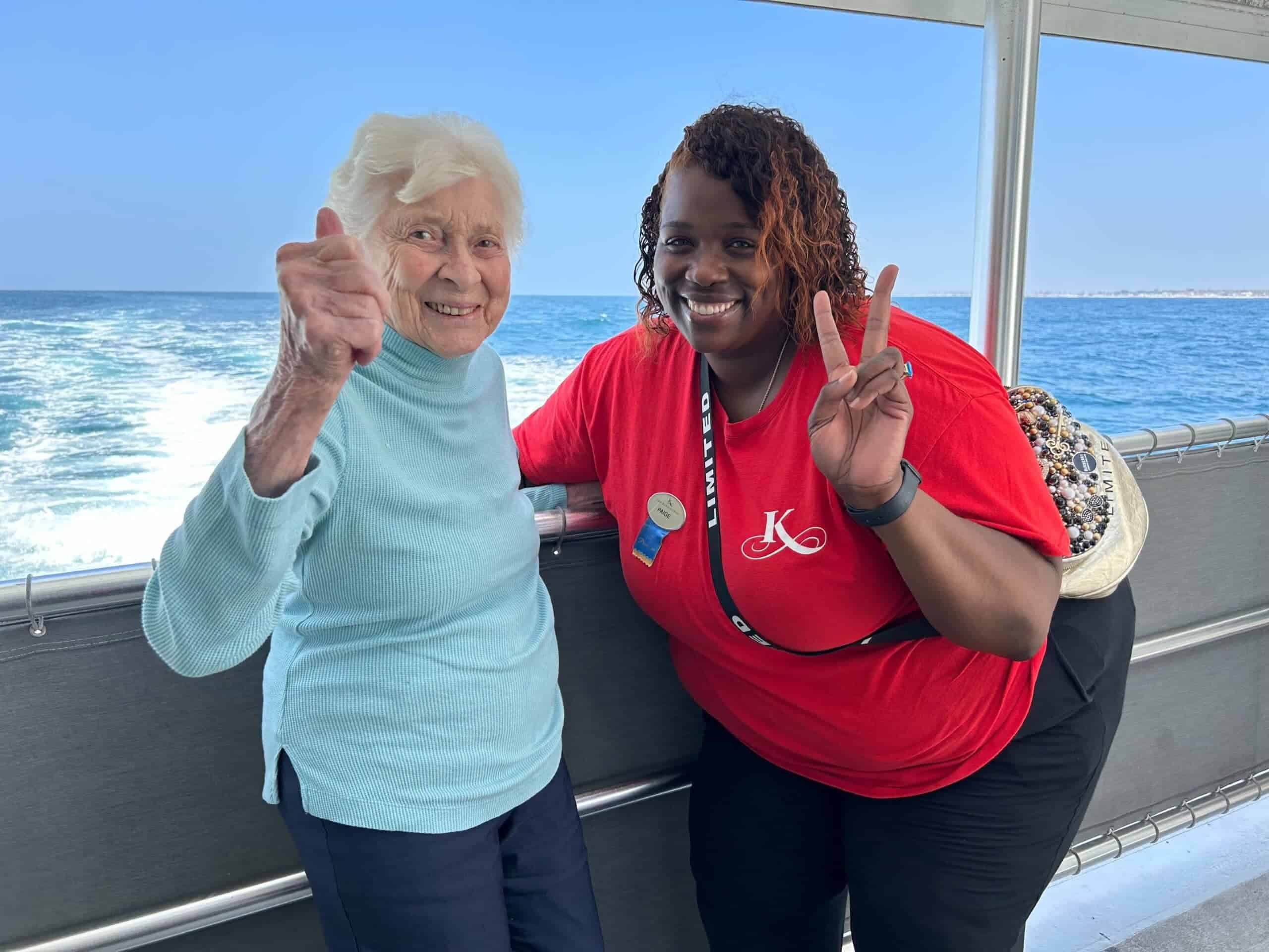 team member and resident during boat ride