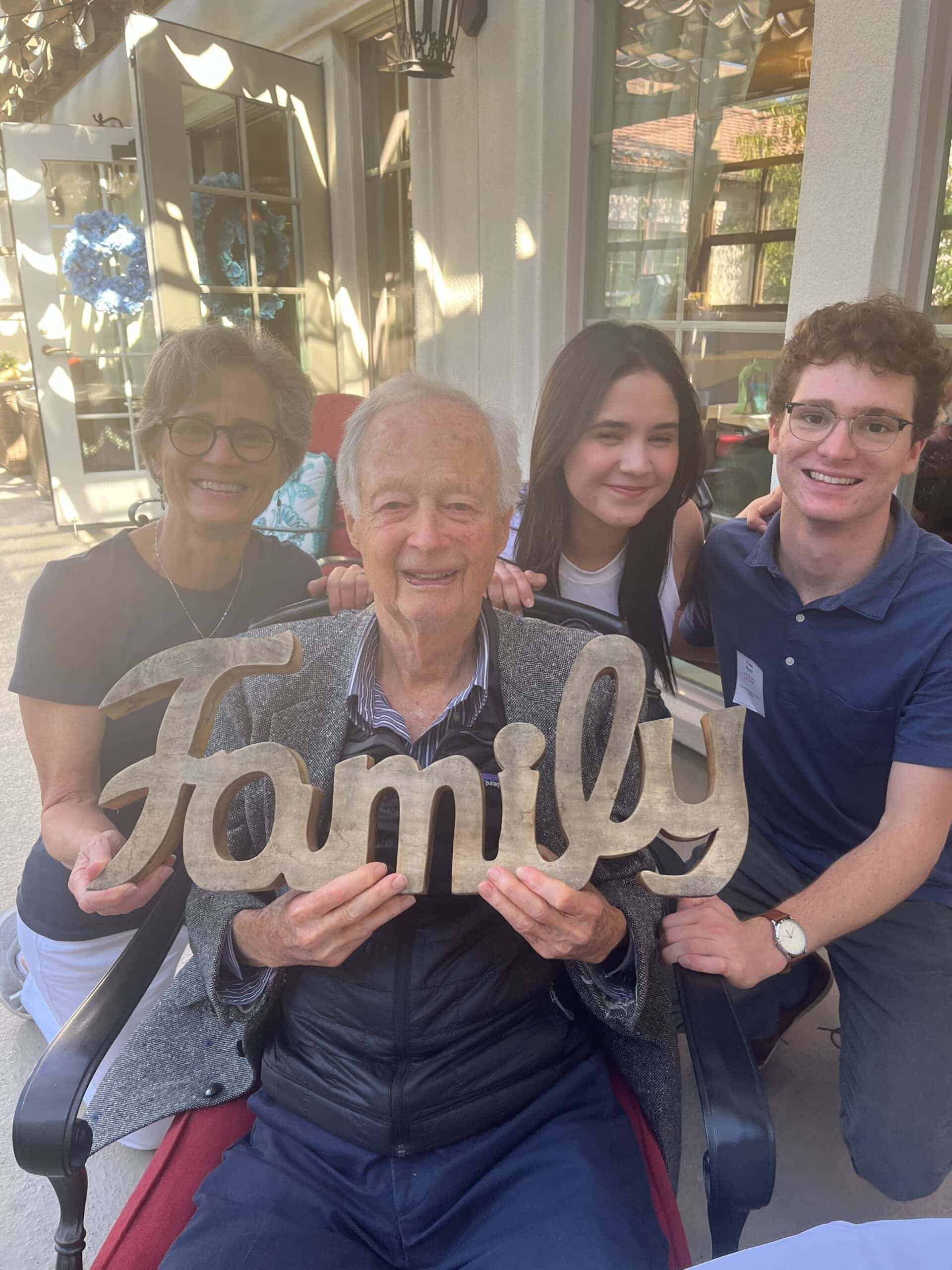 resident and family members holding sign that says family