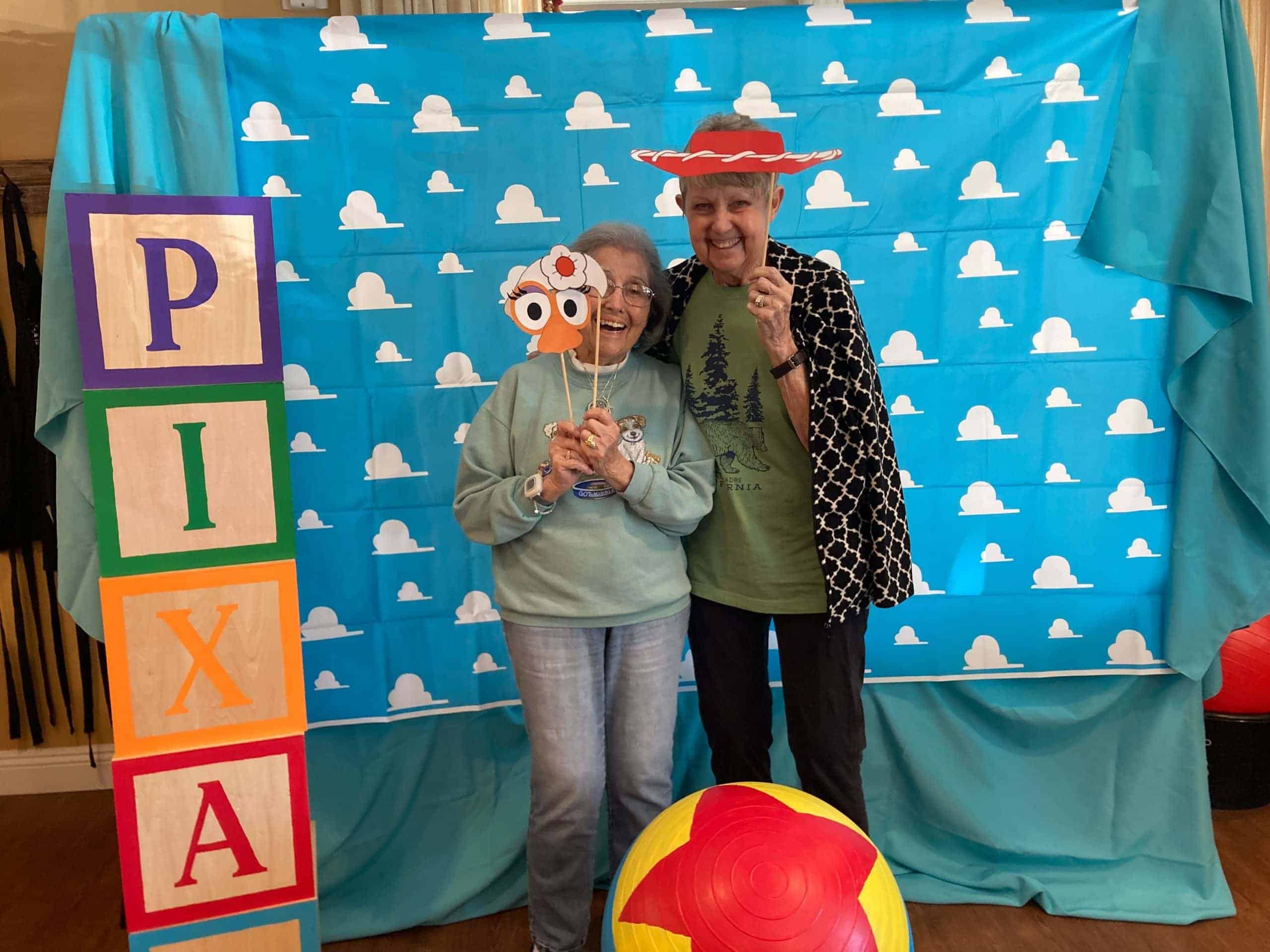 residents posing with props for photo