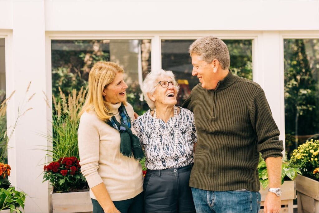 older woman and younger adult couple