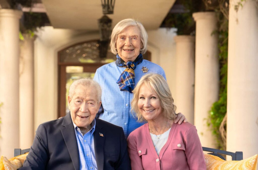 old couple sitting with woman