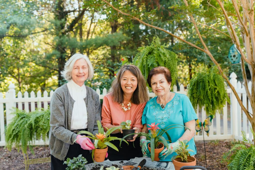 three women gardening together