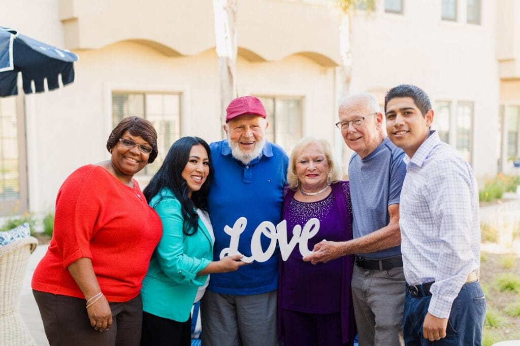 seniors and their family with senior living community team members