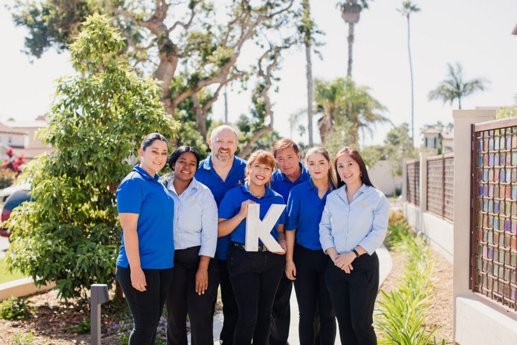 team members standing in front of senior living community