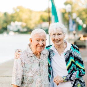 senior couple walking by the lake