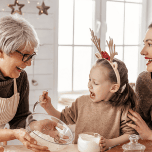 Grandma, mother and daughter baking holiday treats